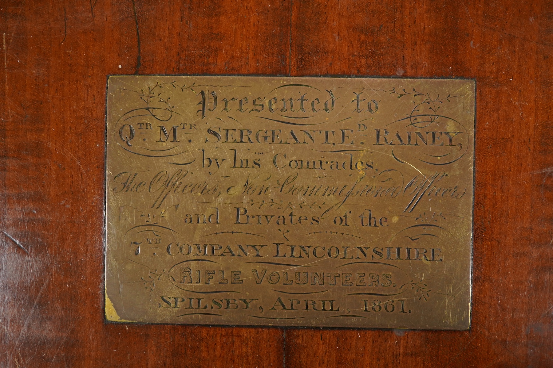A mid 19th century mahogany pedestal Pembroke table, with inset brass plaque engraved; ‘Presented to Qtr. Master Sgt. Ed. Rainey by his Comrades the Officers, Non-Commissioned Officers and Privates of the 7th Company Lin